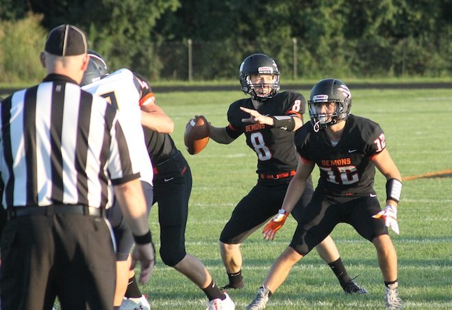 FOOTBALL ROUNDUP:Demons eke out victory thanks to late pick